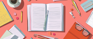 book and pens on a desk